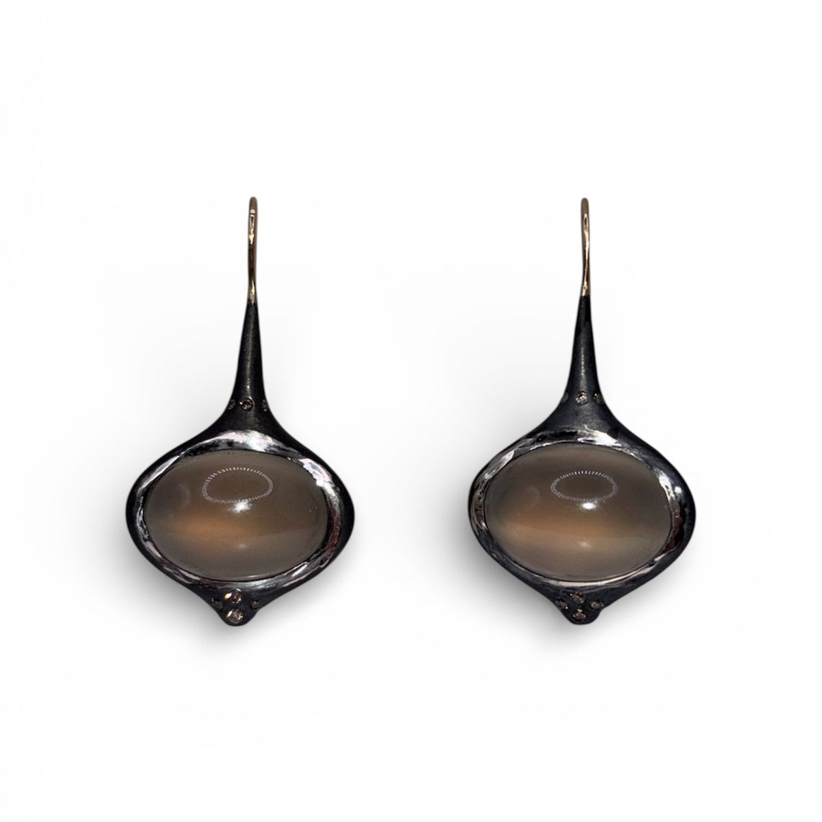 Another view of Grey Oval Moonstone Earrings with Brown Diamond Accents — Oval grey Moonstone cabochons are set in silver, featuring 14k gold affixed earwire, brown diamond accents on top and bottom