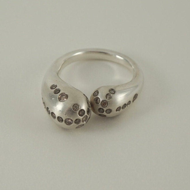 Mercurial diamond-lined ultra-modern silver ring