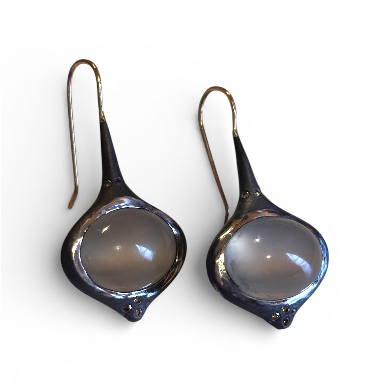 Grey Oval Moonstone Earrings with Brown Diamond Accents — Oval grey Moonstone cabochons are set in silver, featuring 14k gold affixed earwire, brown diamond accents on top and bottom
