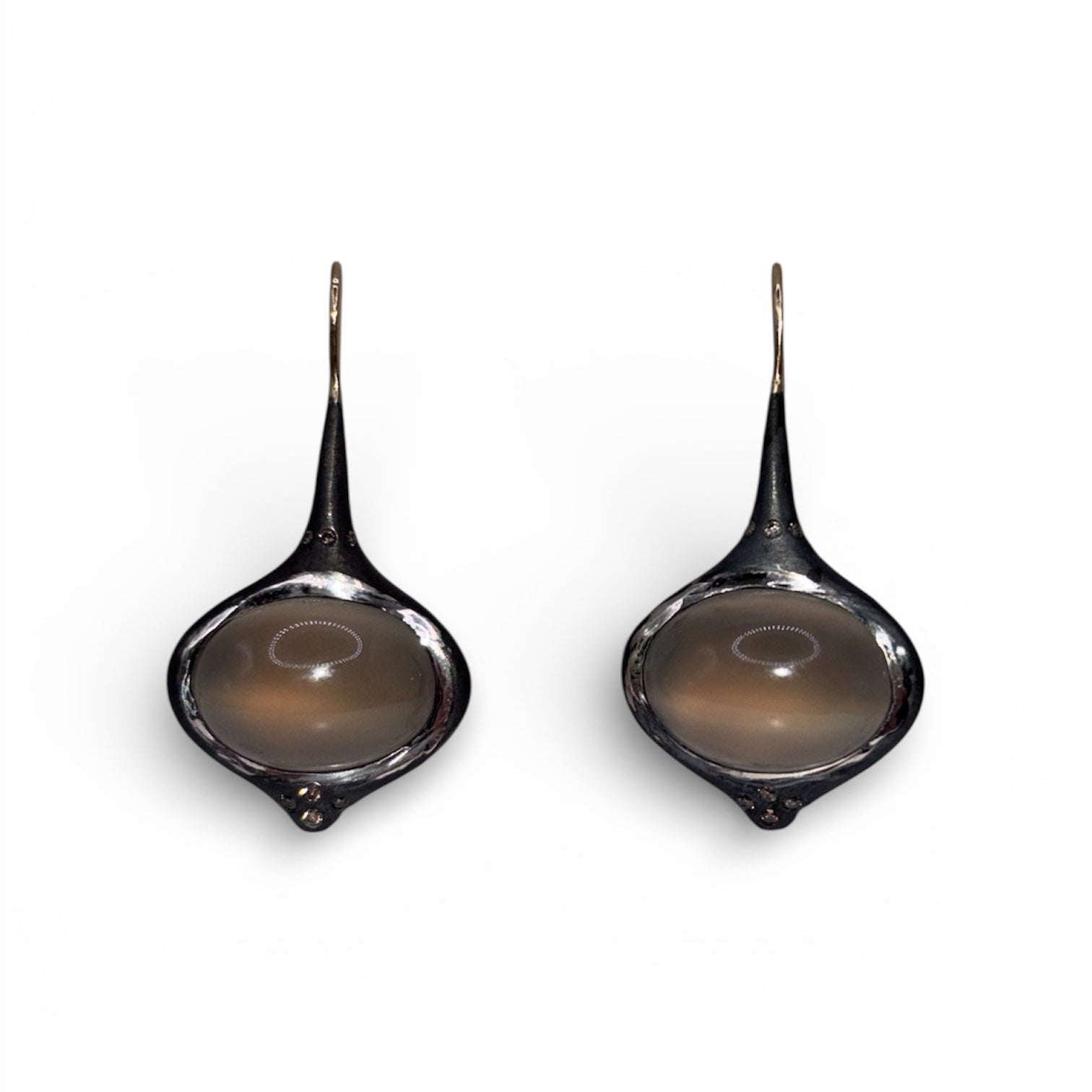 Another view of Grey Oval Moonstone Earrings with Brown Diamond Accents — Oval grey Moonstone cabochons are set in silver, featuring 14k gold affixed earwire, brown diamond accents on top and bottom