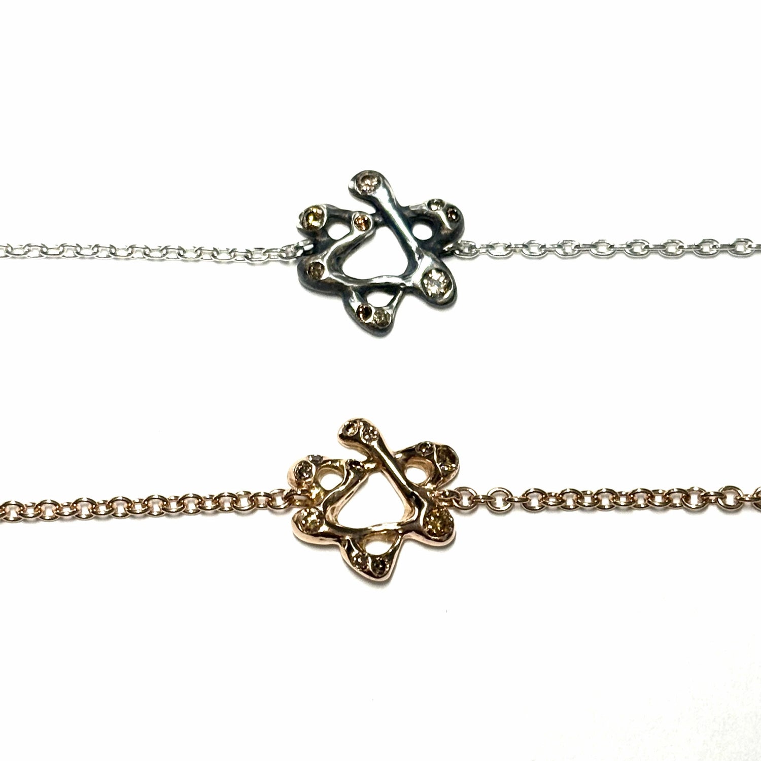 Magen David charm bracelet — Irregularly shaped gold or silver Star of David charm on a matching chain send a powerful yet