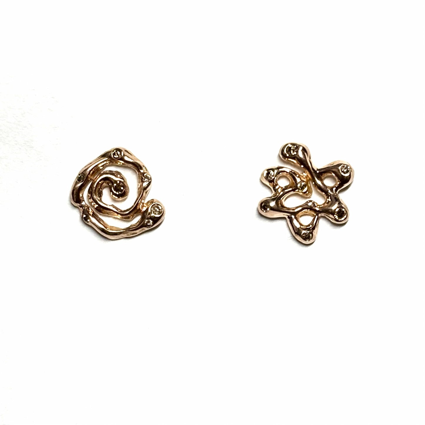 Gold Magen David and swirl mismatched studs